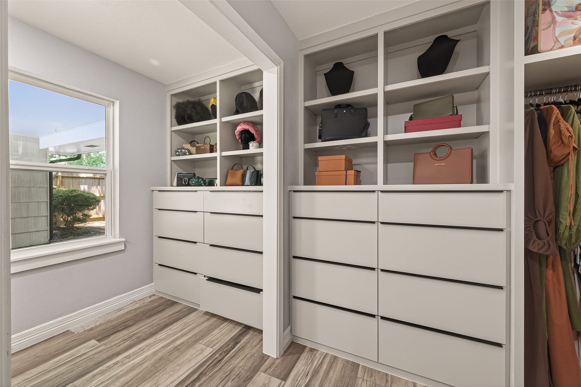 5422 Valerie Street, Bellaire, TX 77401 This well-designed walk-in closet offers abundant shelving, drawer space, and organization options, creating a functional and stylish retreat with room for all your wardrobe essentials.