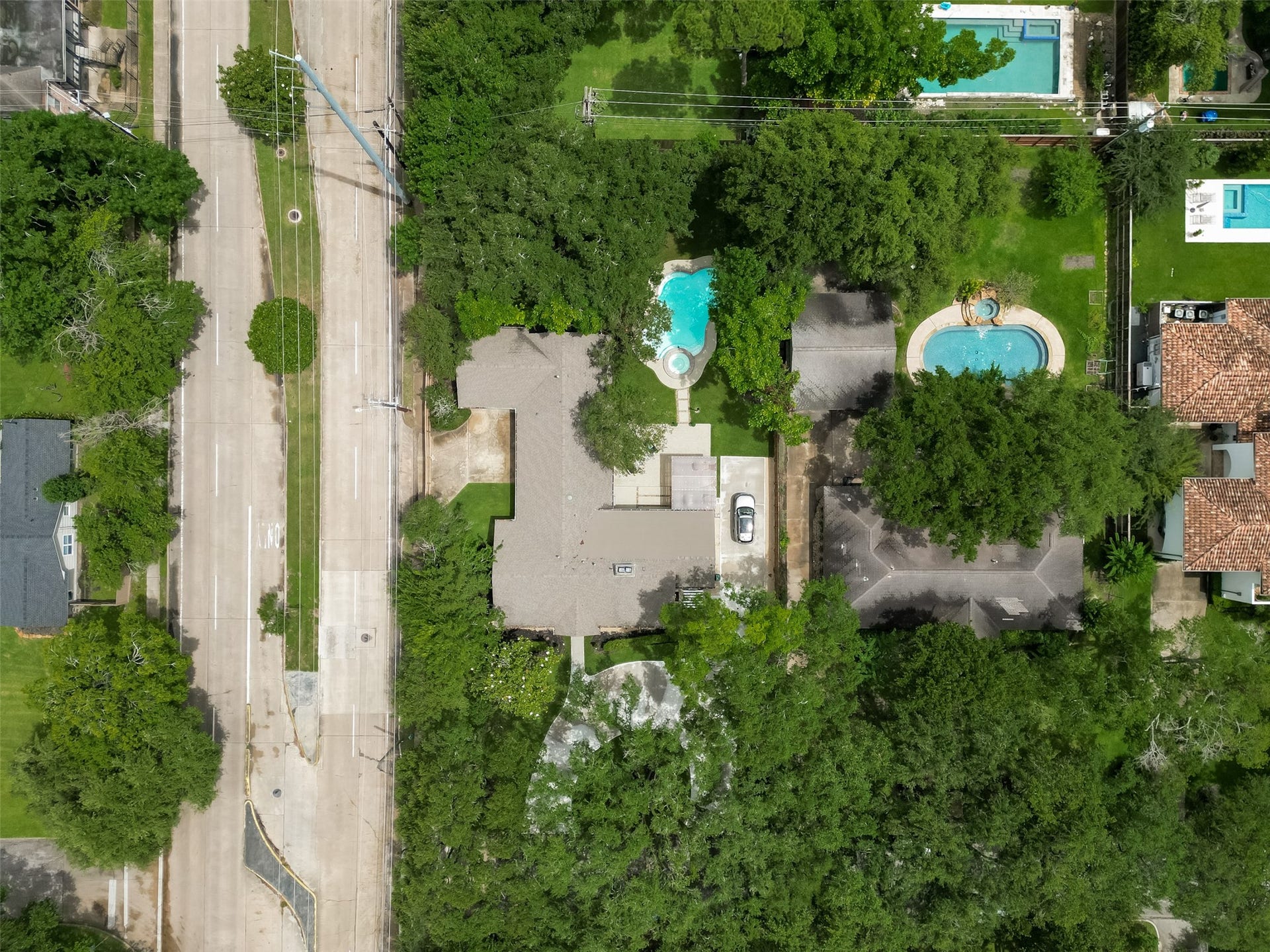 5422 Valerie Street, Bellaire, TX 77401 This aerial view highlights the 0.47-acre lot, showcasing the home, backyard pool, and expansive outdoor space.