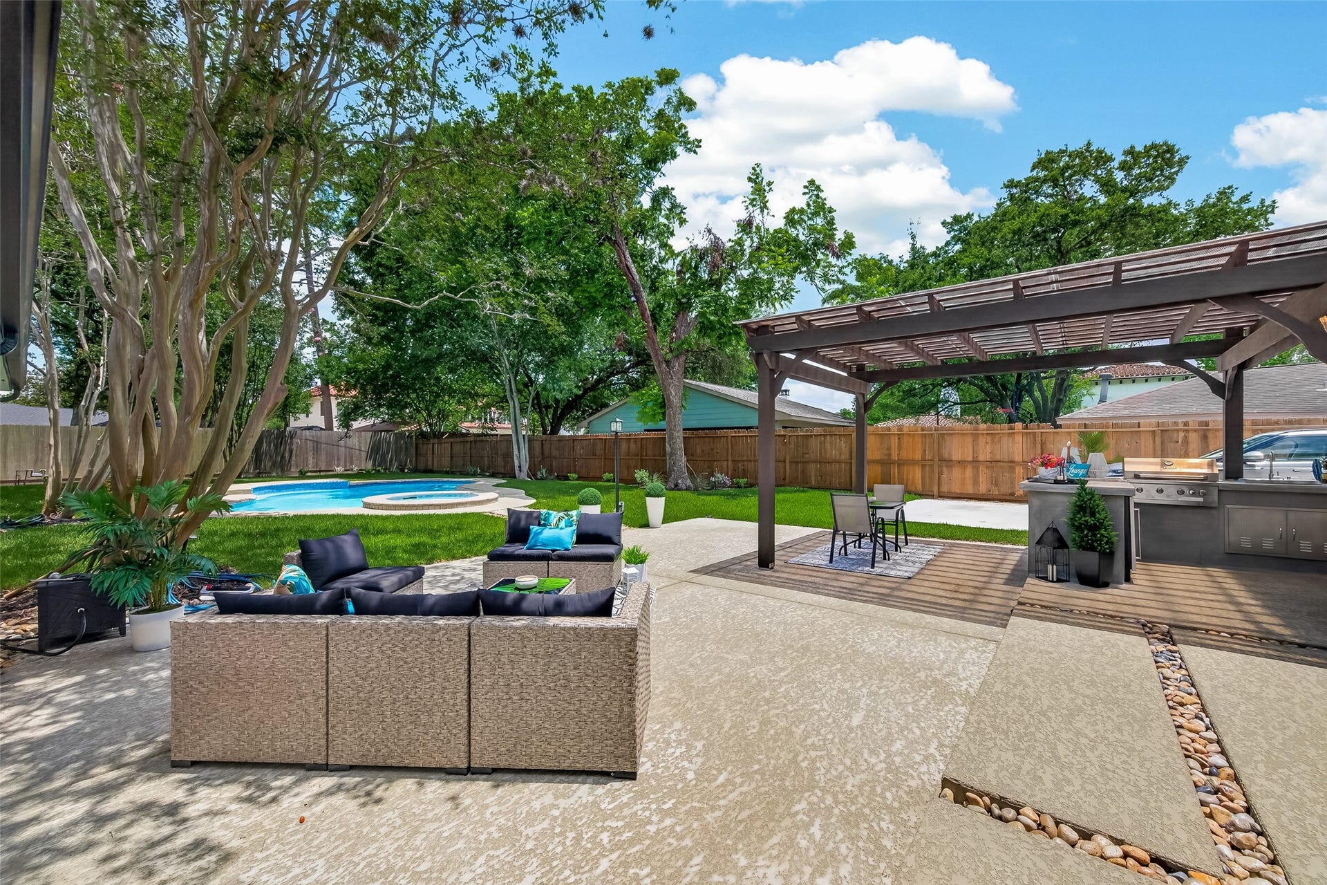 5422 Valerie Street, Bellaire, TX 77401 Spacious outdoor patio adjacent to the pergola and pool, ideal for sun-filled lounging, relaxing, and entertaining.