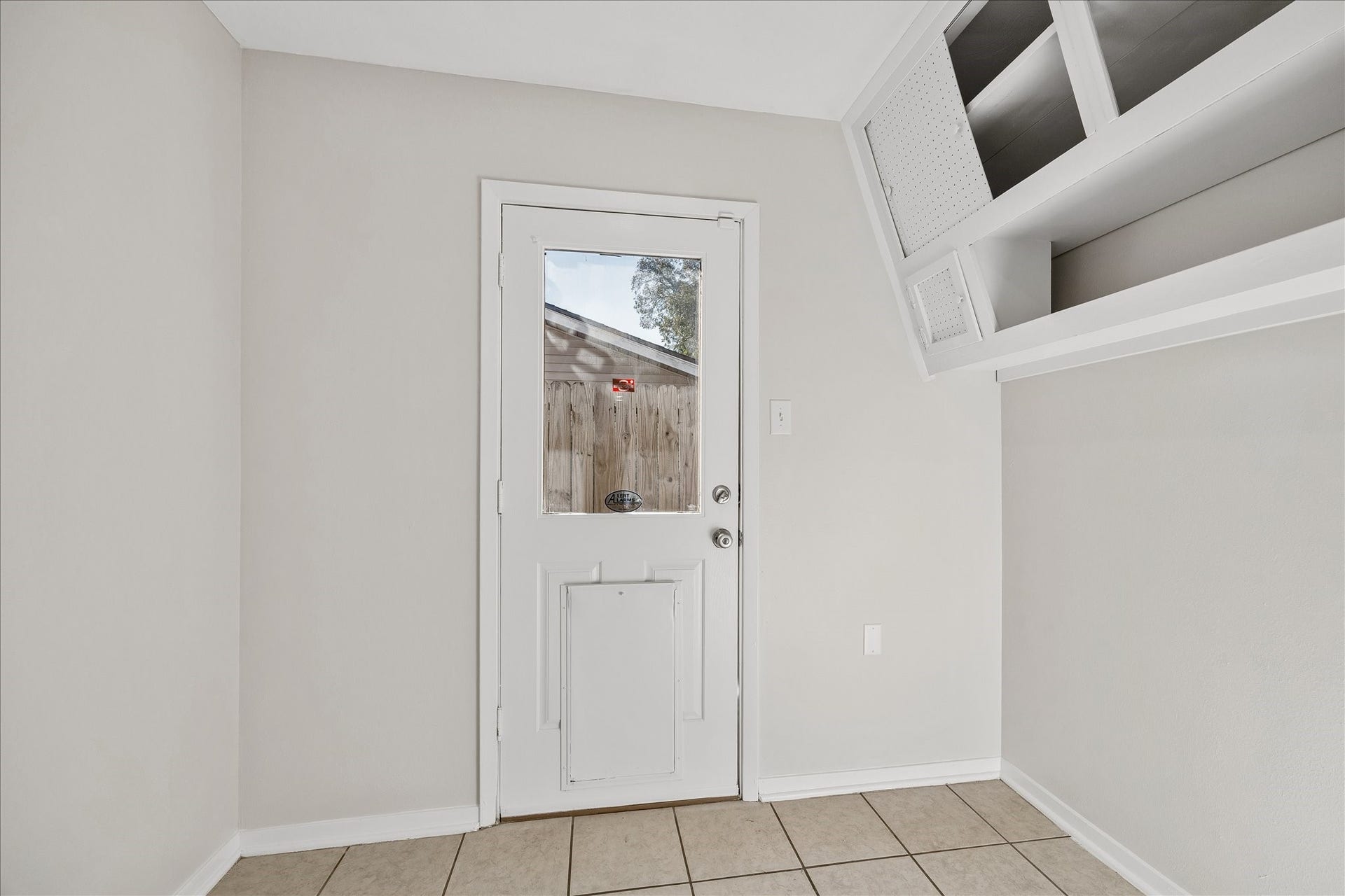 7824 Yucca Drive, Texas City, TX 77591 The mud room leading to the backyard has some storage space and room for a fridge or deep freeze.