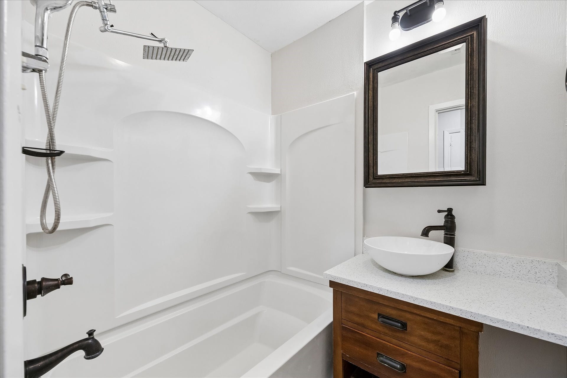 7824 Yucca Drive, Texas City, TX 77591 Bathroom 2 features a tub/shower combo and updated vanity area.