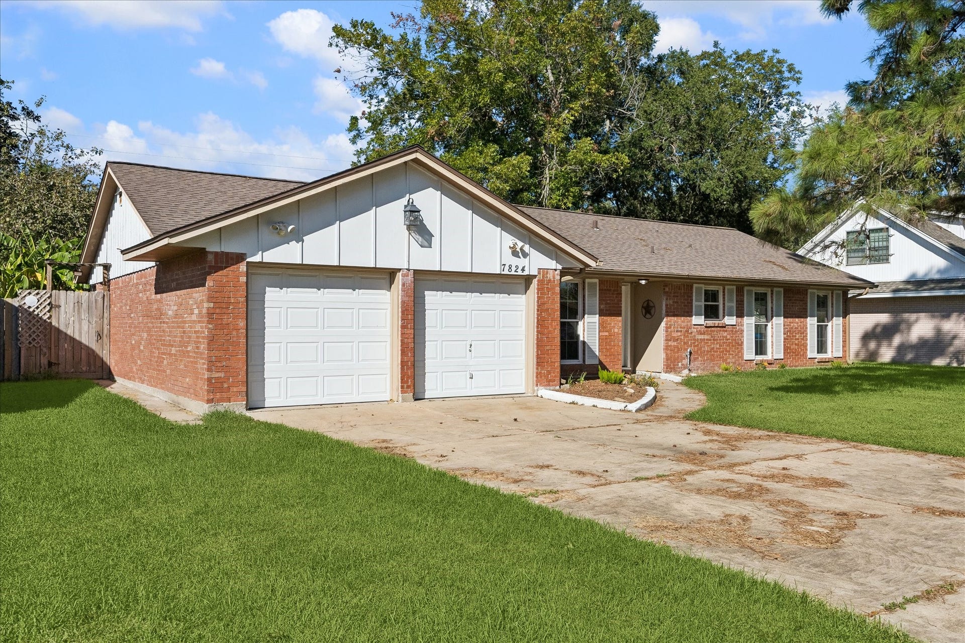 7824 Yucca Drive, Texas City, TX 77591 A view of the driveway and garage. Such an inviting home.