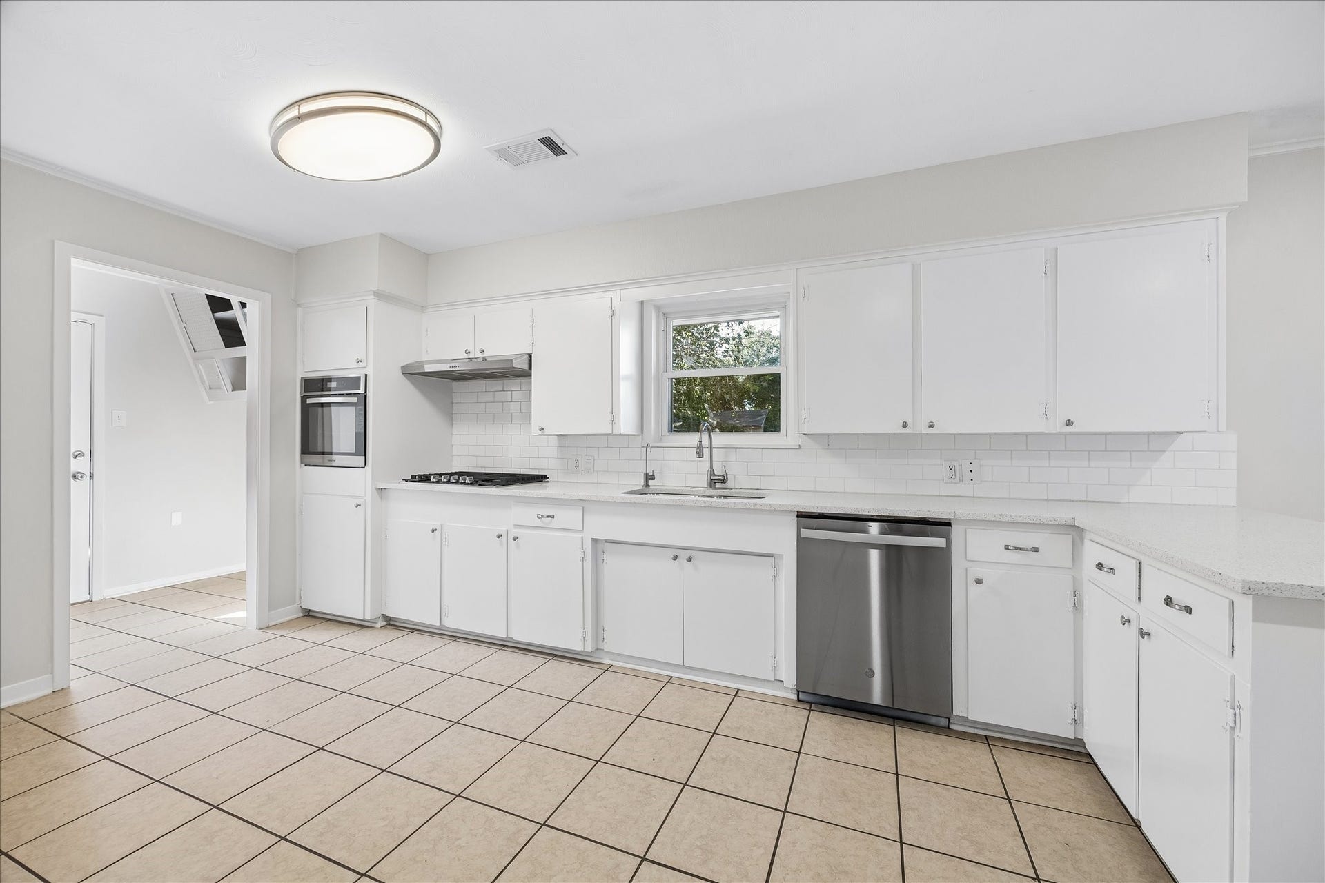 7824 Yucca Drive, Texas City, TX 77591 A view of the kitchen and the mudroom. Notice how light and bright this space is.