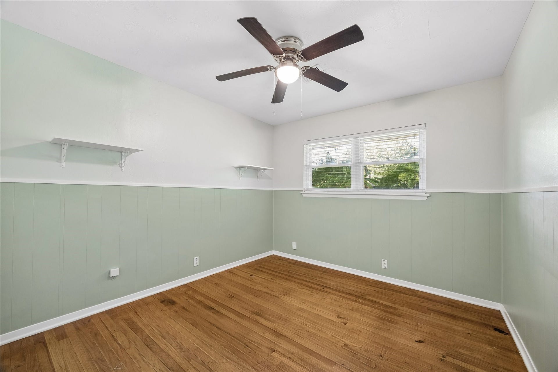 7824 Yucca Drive, Texas City, TX 77591 Bedroom 3 has a light paint and wood floors.