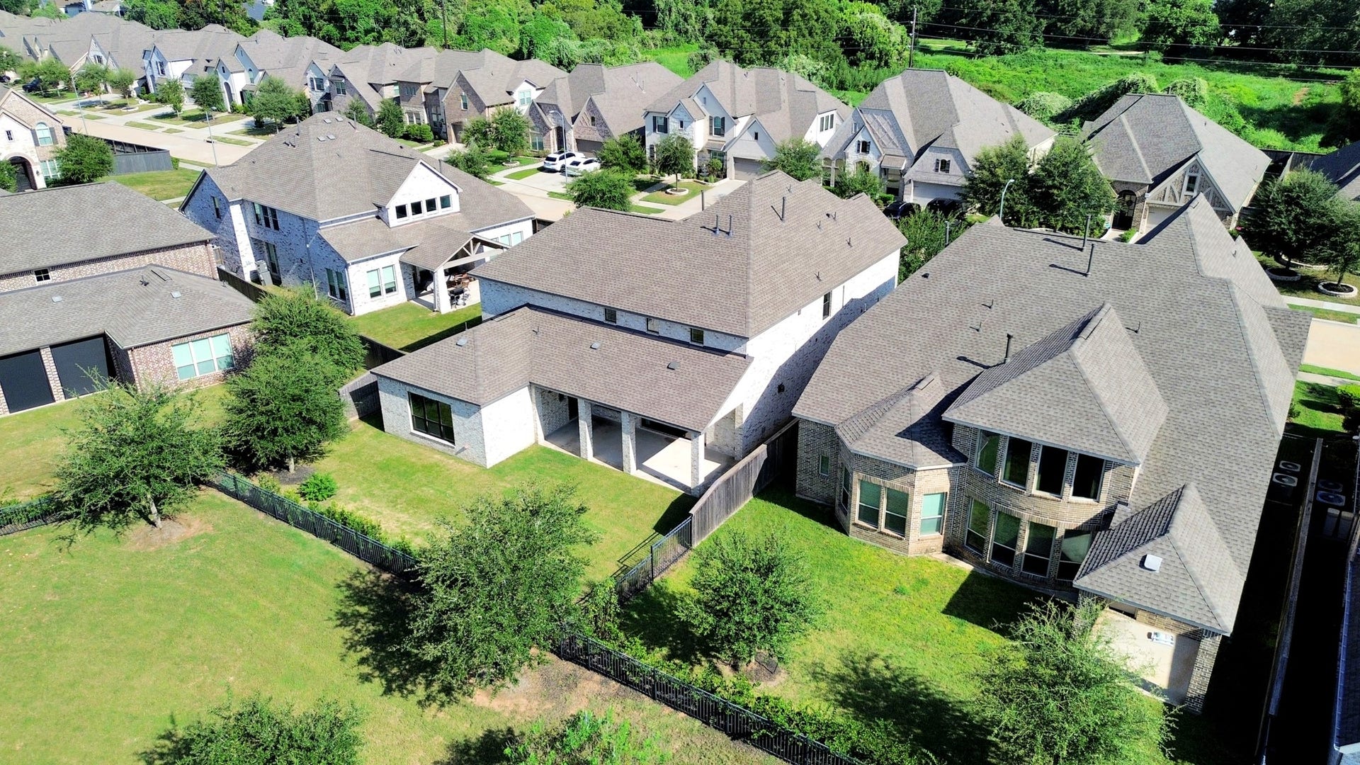 1423 Hackberry Heights Drive, Richmond, TX 77406 Charming suburban neighborhood featuring spacious, modern homes with well-maintained yards and lush greenery, offering a peaceful and family-friendly environment.