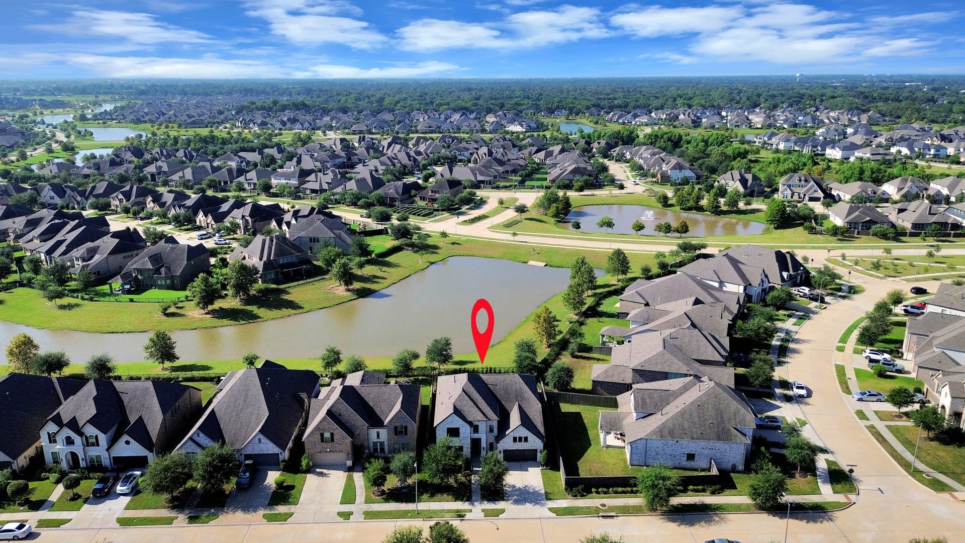 1423 Hackberry Heights Drive, Richmond, TX 77406 Charming lakeside home nestled in a picturesque neighborhood with winding streets and beautifully landscaped yards.