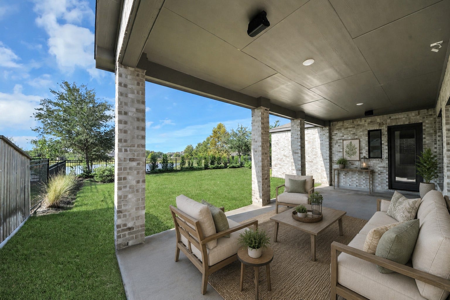 1423 Hackberry Heights Drive, Richmond, TX 77406 Virtually staged. Experience the perfect blend of indoor and outdoor living with this beautifully designed covered patio, offering serene garden views and ample space for relaxation and entertainment.