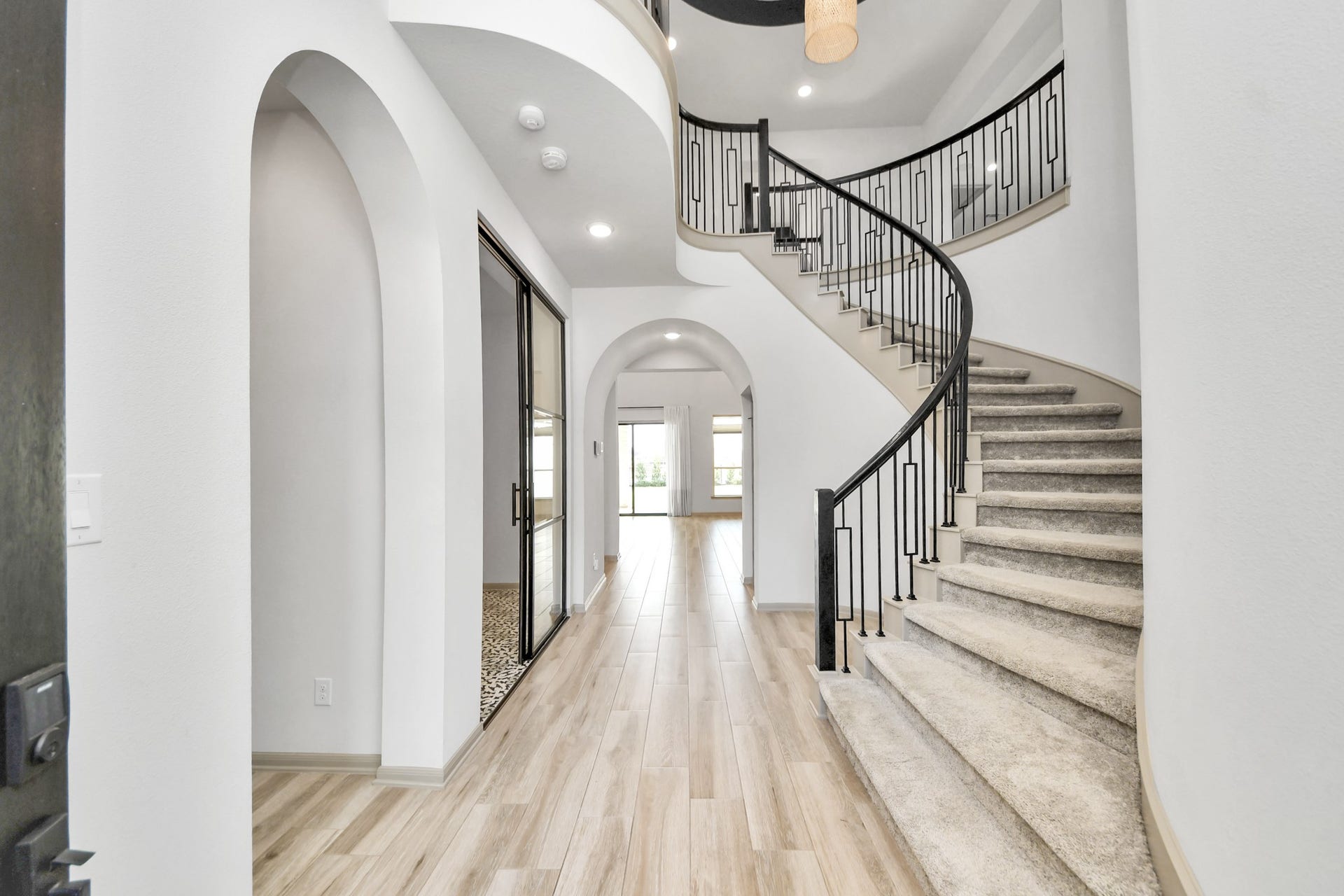 1423 Hackberry Heights Drive, Richmond, TX 77406 Elegant foyer with a sweeping curved staircase.