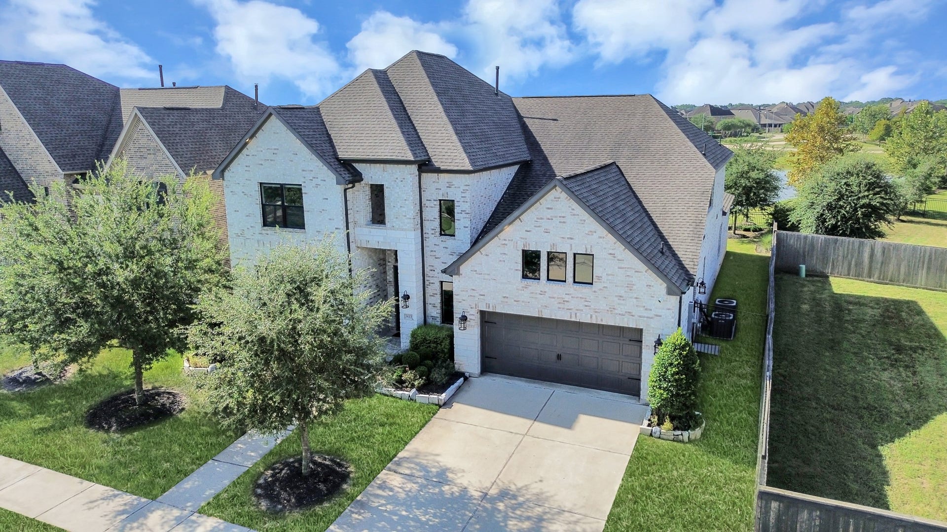 1423 Hackberry Heights Drive, Richmond, TX 77406 Stunning two-story brick home with a modern design.