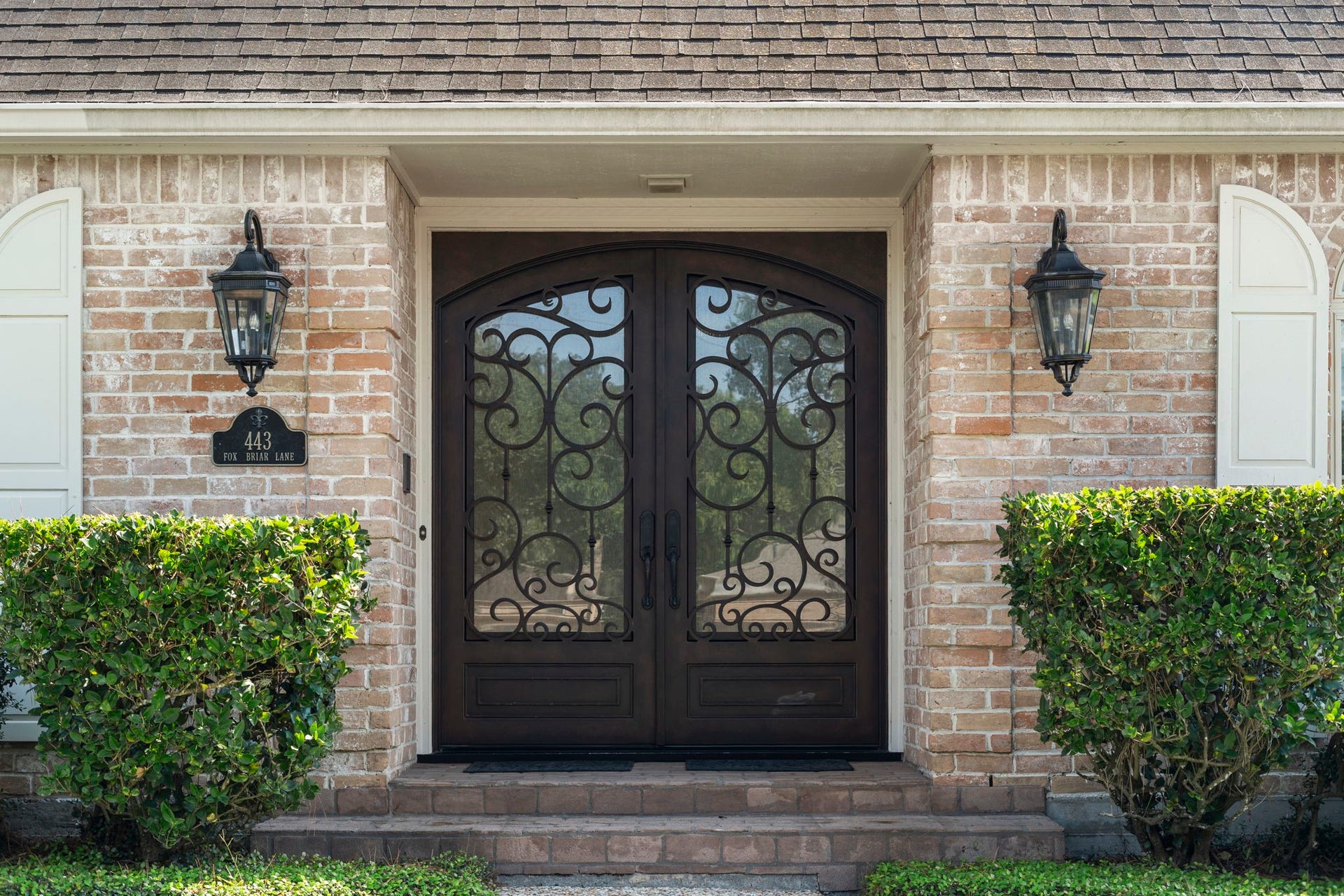443 Fox Briar Lane, Sugar Land, TX 77478 Ornate double iron doors with integrated insulated glass panels fill the entry with natural light while helping maintain a comfortable indoor climate. Installed in May 2019.