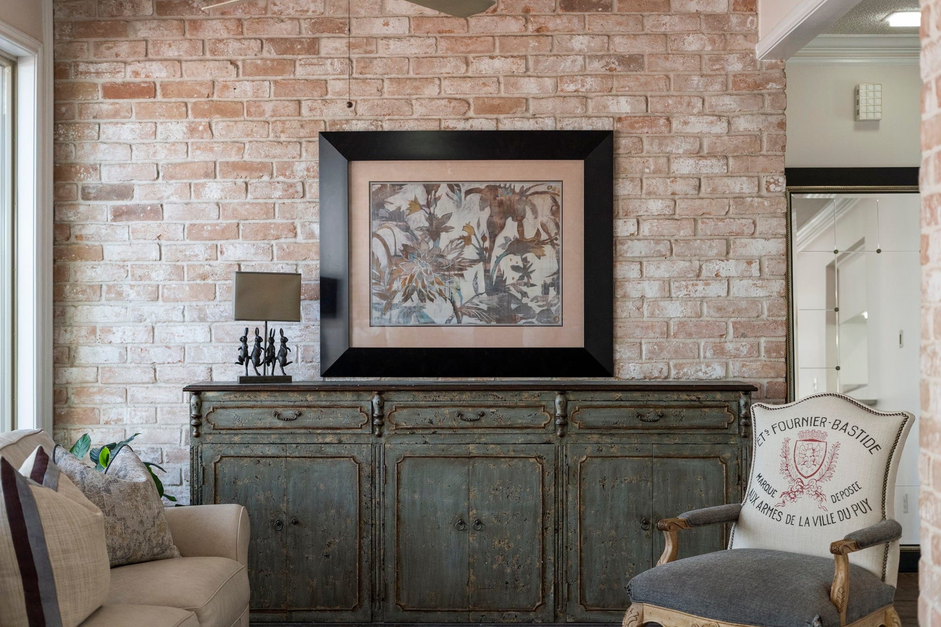 443 Fox Briar Lane, Sugar Land, TX 77478 Exposed brick walls provide a warm, textural backdrop and infuse the space with timeless New Orleans character.