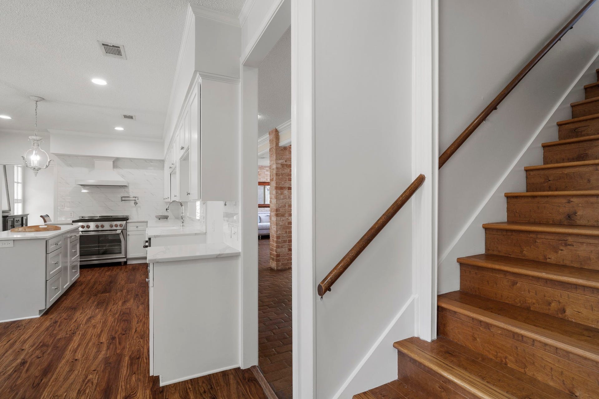 443 Fox Briar Lane, Sugar Land, TX 77478 A staircase from the kitchen leads to the second-floor living spaces, creating an easy connection between levels.