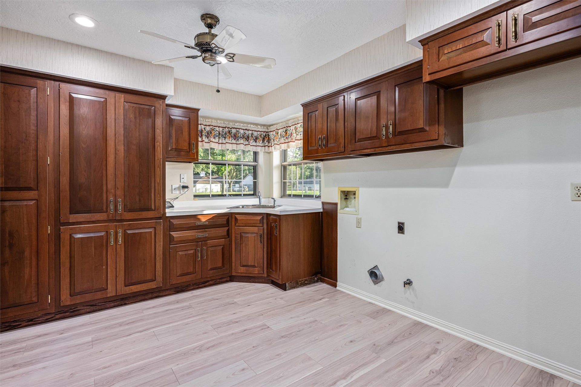 1715 Avenue D, Katy, TX 77493 Far more than a utility room, this oversized workspace provides extensive cabinetry, a utility sink and abundant room for laundry, storage and everyday organization.