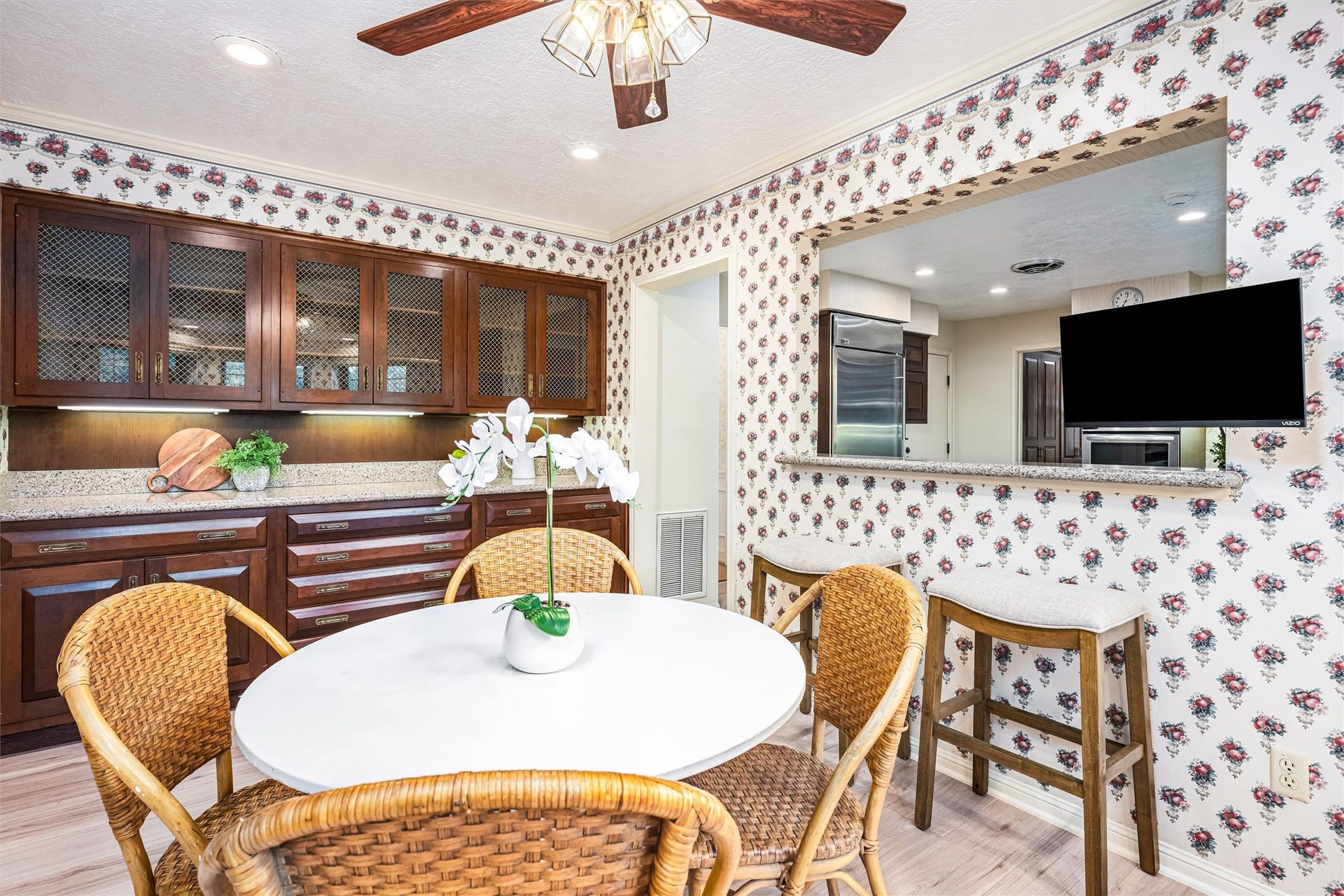 1715 Avenue D, Katy, TX 77493 Open to the kitchen through a convenient pass-through, the breakfast room features custom built-ins for a warm, inviting space for casual dining and everyday gatherings.