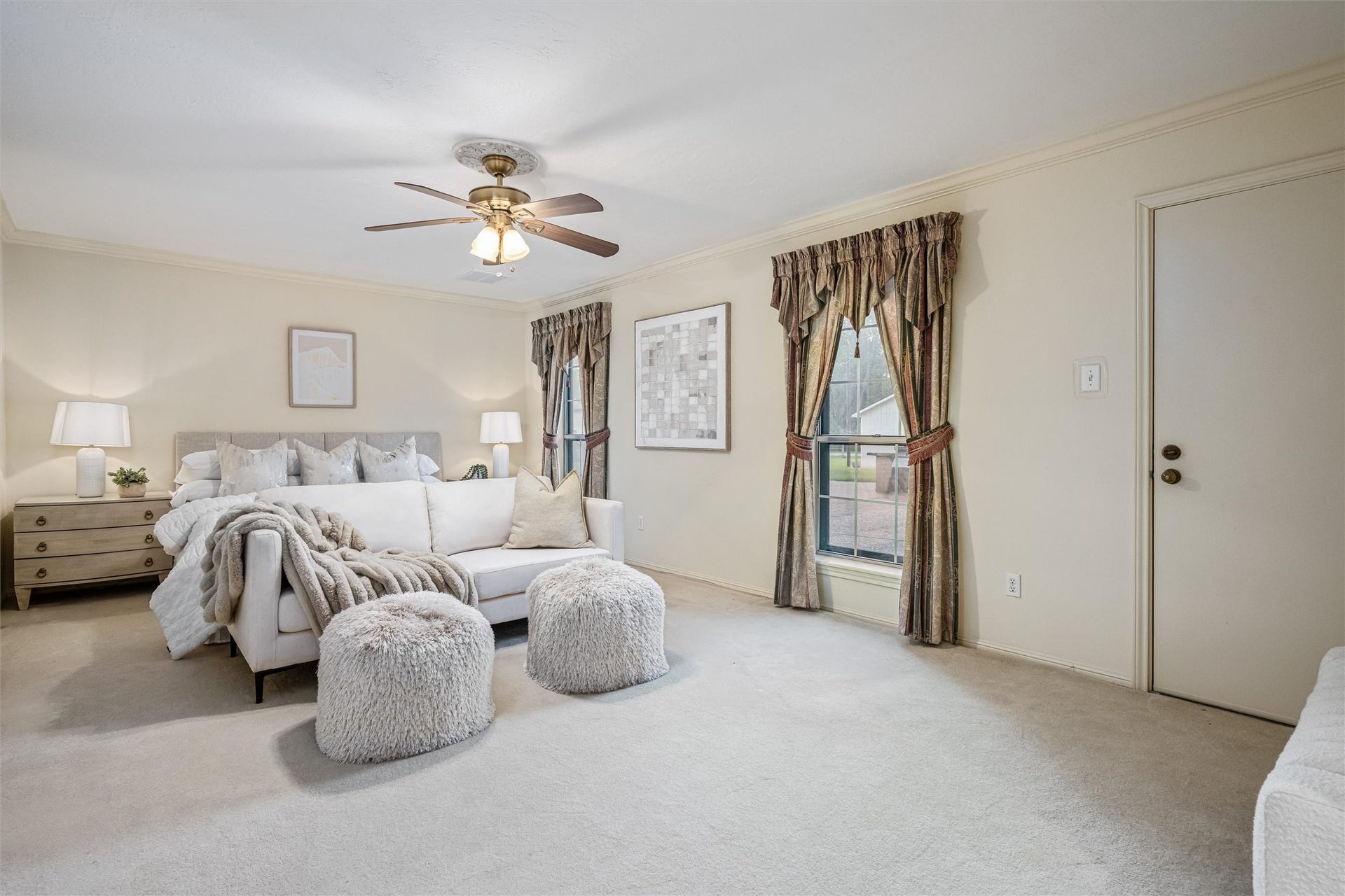 1715 Avenue D, Katy, TX 77493 Peaceful backyard views, private patio access and abundant natural light create a serene primary retreat.