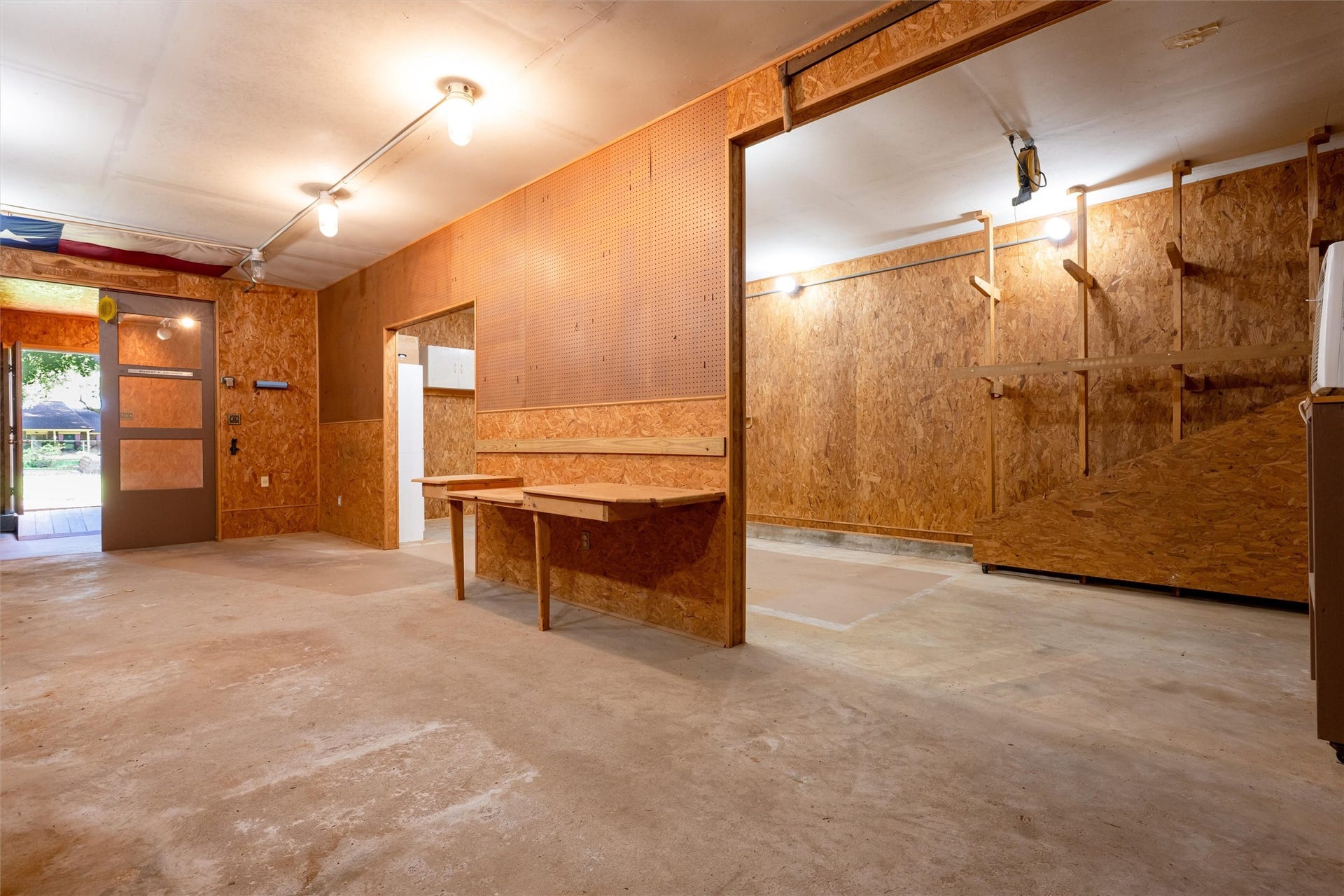 1715 Avenue D, Katy, TX 77493 Thoughtfully crafted with separate work zones, the workshop includes a partitioned front room, creating exceptional flexibility for woodworking, creative pursuits, or specialized projects.