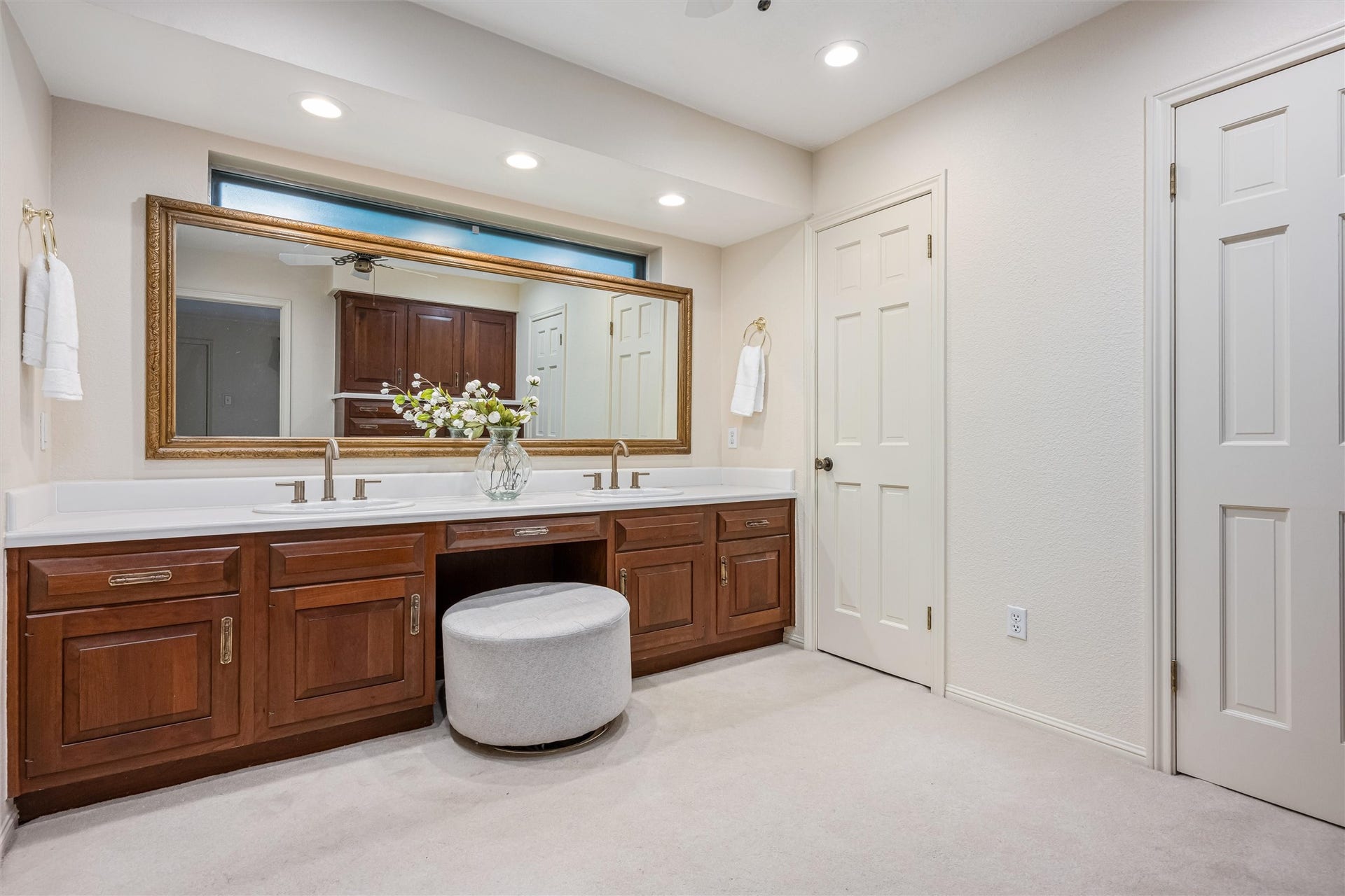 1715 Avenue D, Katy, TX 77493 The spacious vanity area is complete with dual sinks, generous counter space and separate walk-in closets, while a privacy door leads to the bathing area.