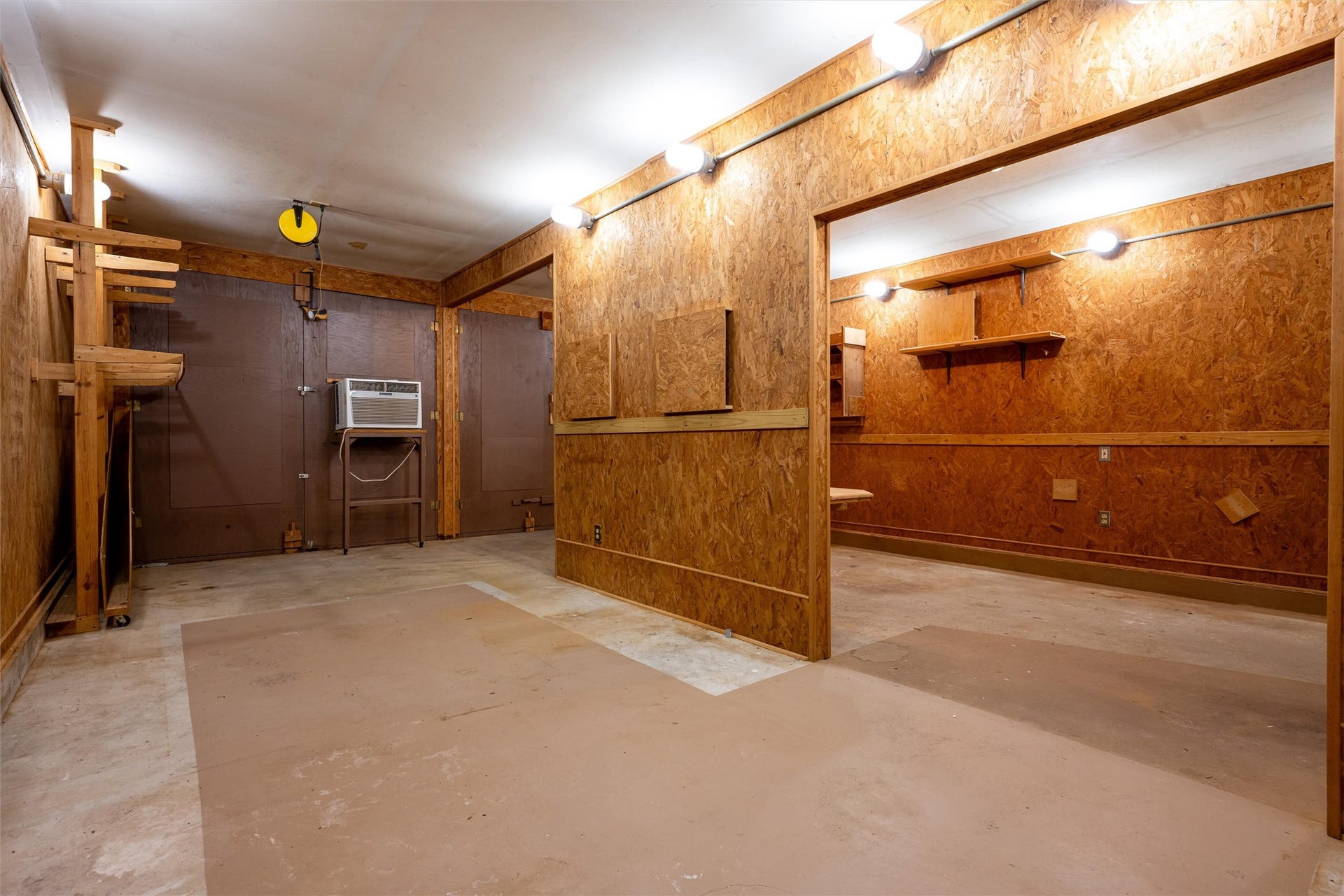 1715 Avenue D, Katy, TX 77493 An air-conditioned workshop with dual rear doors that open wide provides added comfort and makes it easy to move large projects, materials, and equipment.