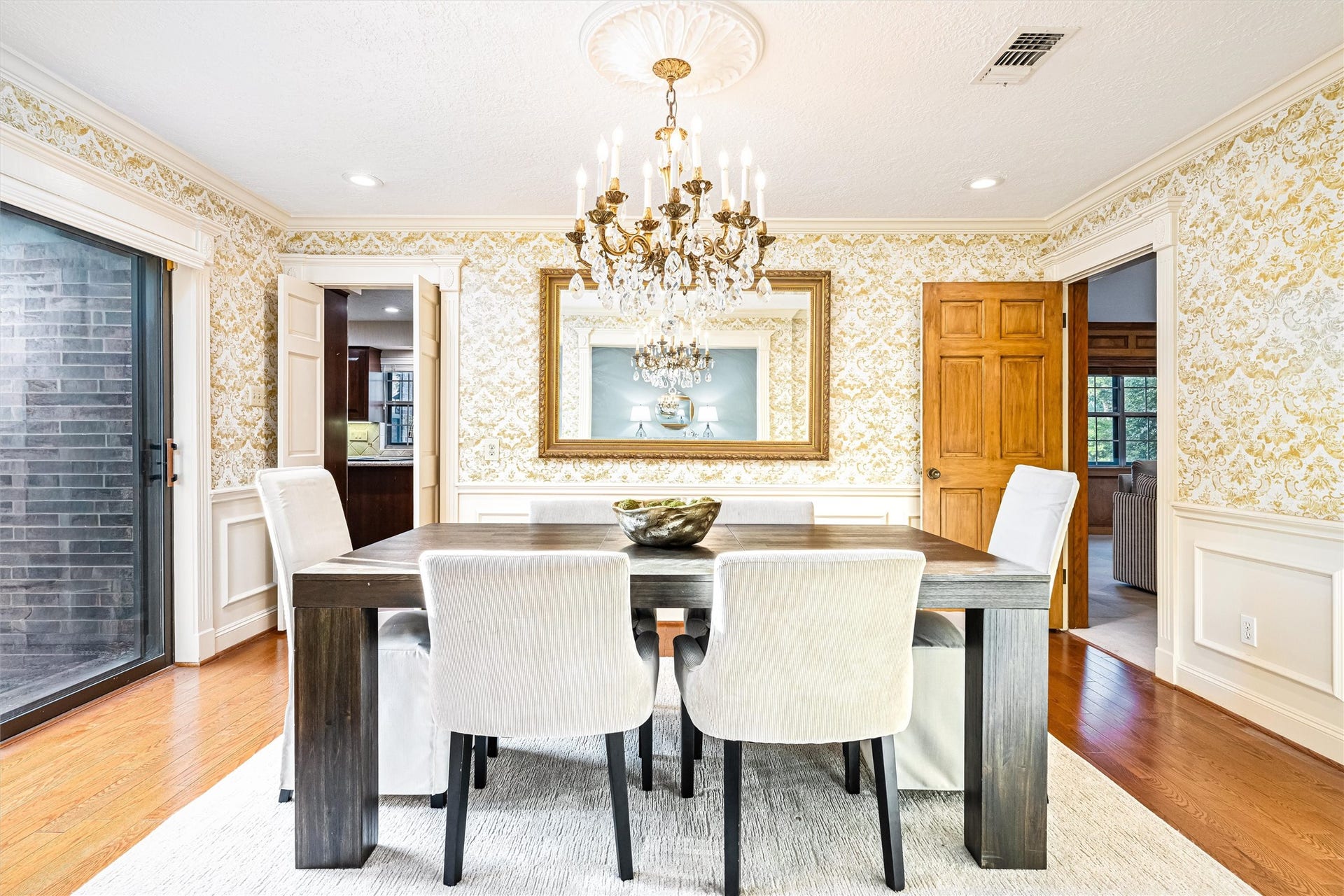 1715 Avenue D, Katy, TX 77493 Perfectly positioned at the heart of the home, the formal dining room enjoys seamless connections to the living room, kitchen and outdoor entertaining areas.