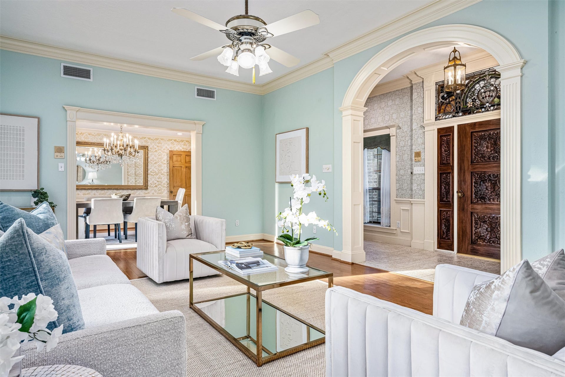 1715 Avenue D, Katy, TX 77493 The formal living room enjoys equisite views of the grand foyer and dining room, highlighting the home's timeless design and inviting flow.
