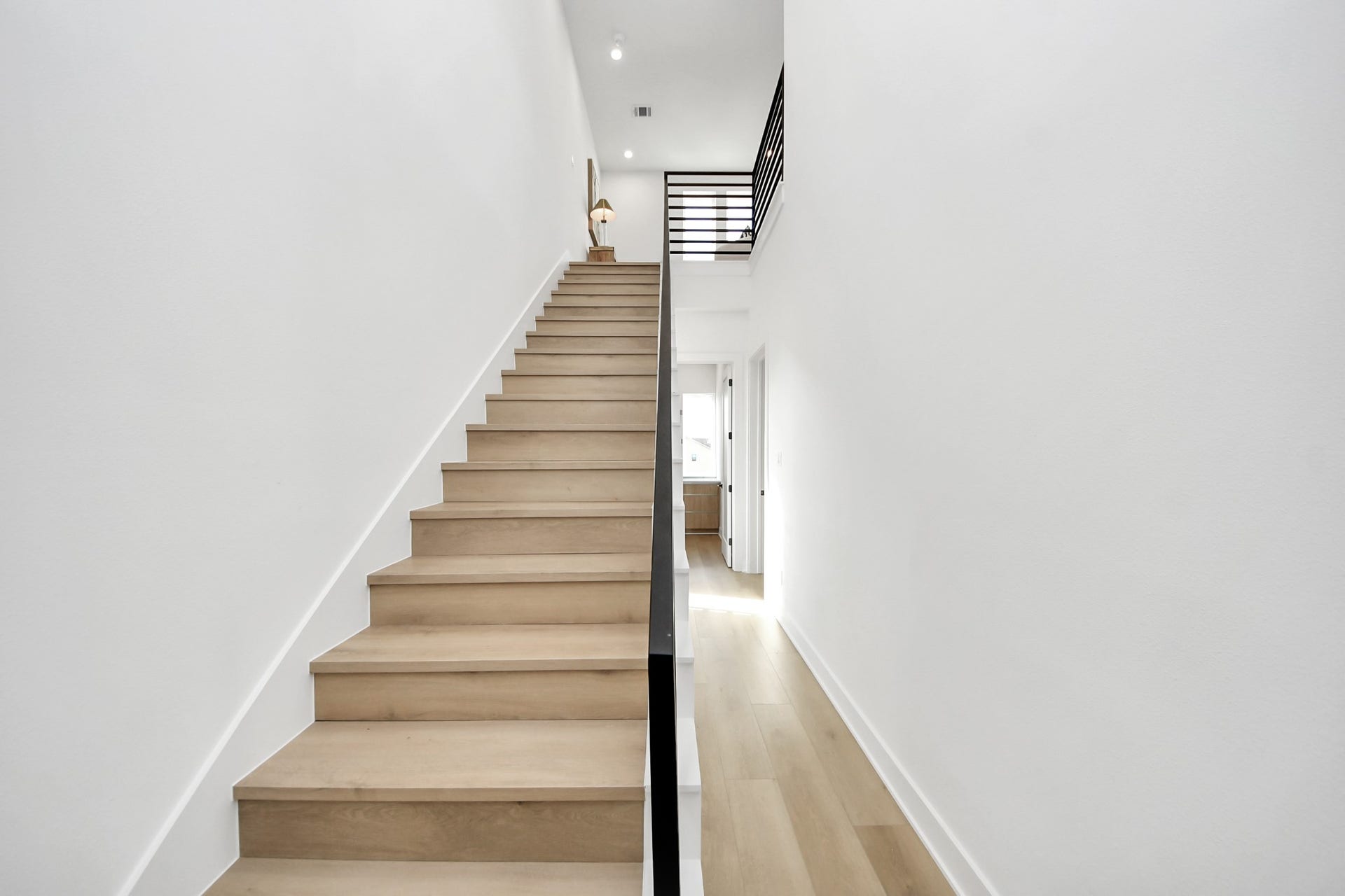 1603 W 25th Street, Houston, TX 77008 Modern staircase leading to the fourth-floor living space and rooftop terrace.