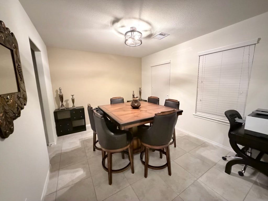 2806 Bretton Woods Drive, Conroe, TX 77301 Discover a charming dining area with a warm ambiance, featuring ample natural light to create inviting gatherings.