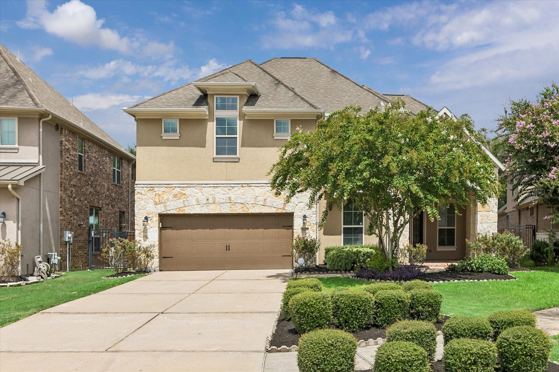 11127 Glasgill Court, Richmond, TX 77407 Front Elevationa with Beautiful curb appeal with a charming brick and stone exterior