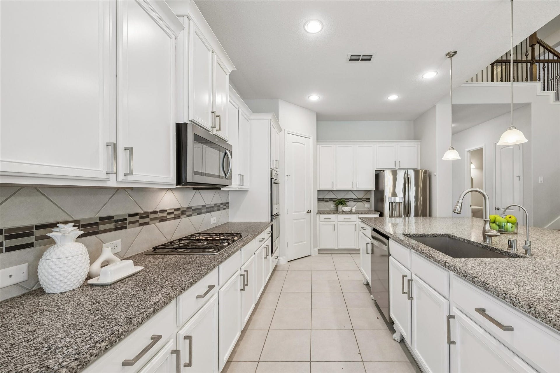11127 Glasgill Court, Richmond, TX 77407 Kitchen Workspace Functional kitchen with extensive counter space and storage