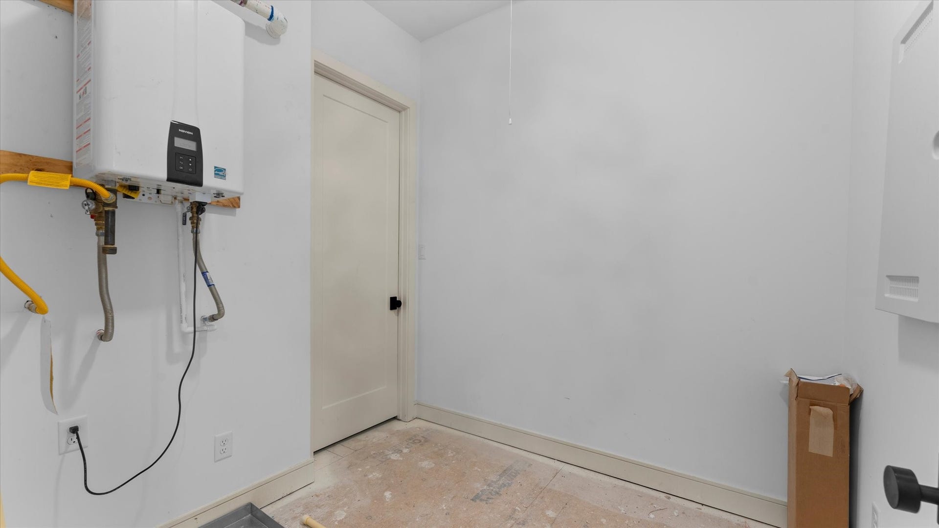 Extra storage room on the first floor leading into the attic space.