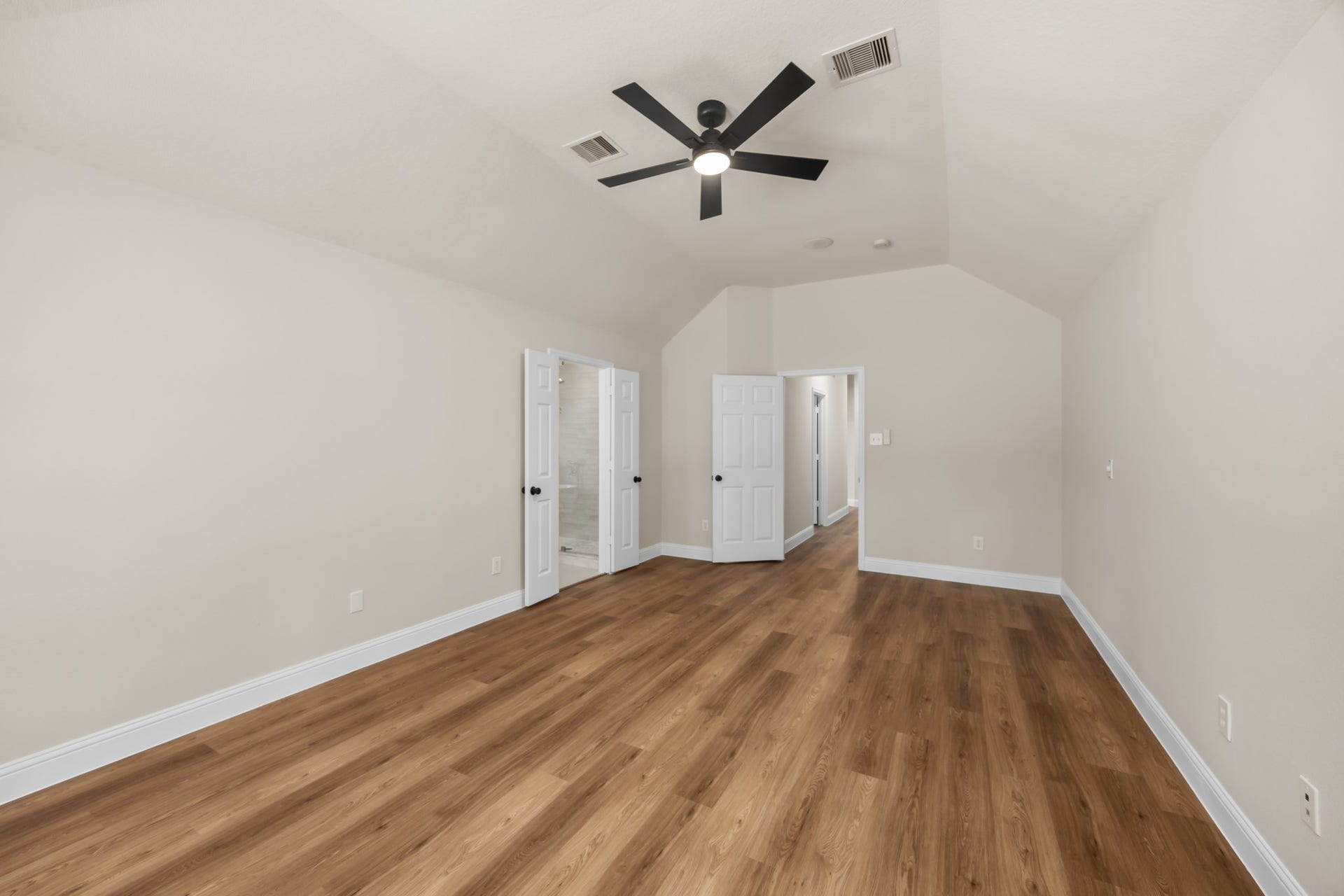 2 Gilded Crest Court, The Woodlands, TX 77382 Primary bedroom with updated primary bathroom attached.