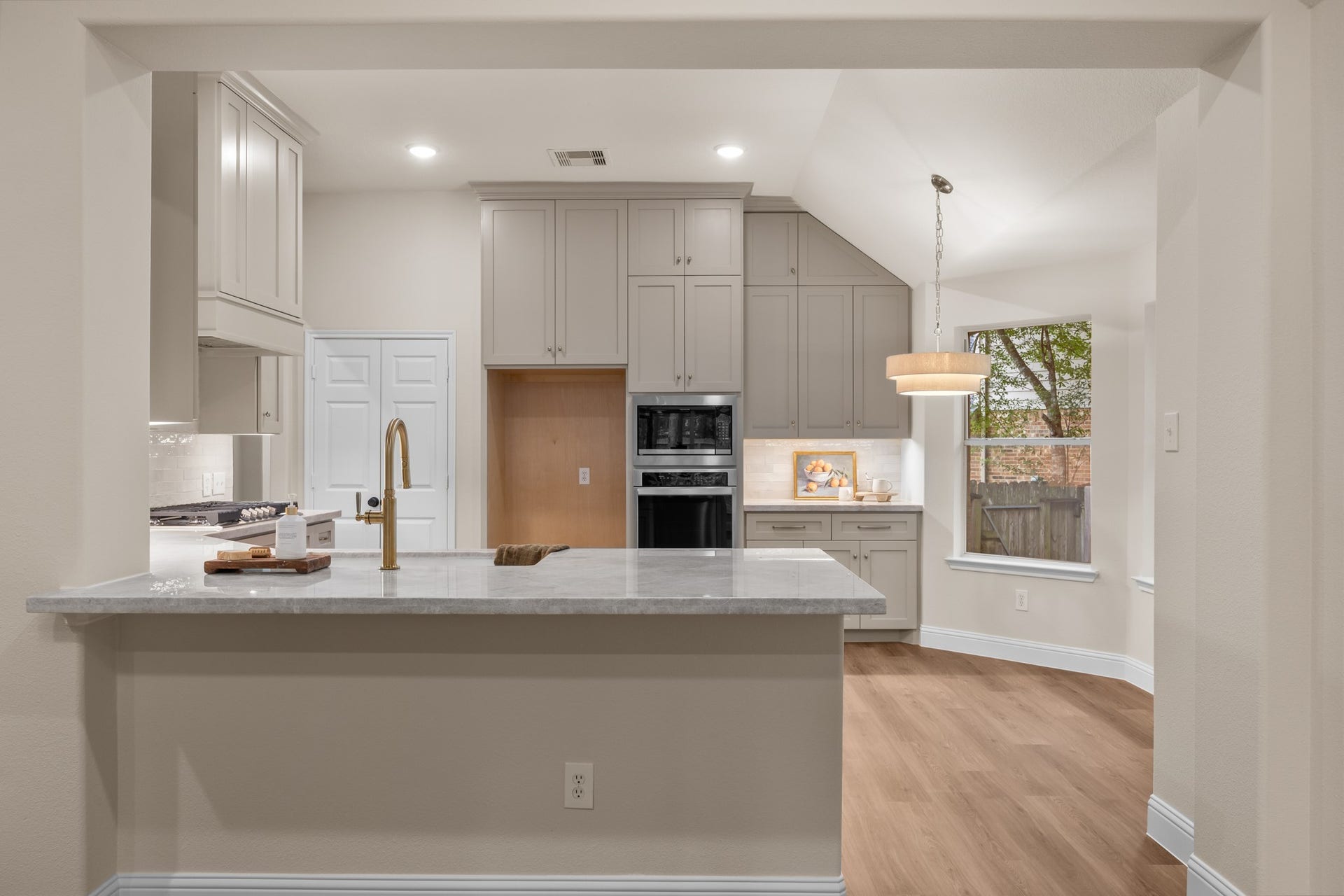 2 Gilded Crest Court, The Woodlands, TX 77382 Completely updated kitchen open to the living room.