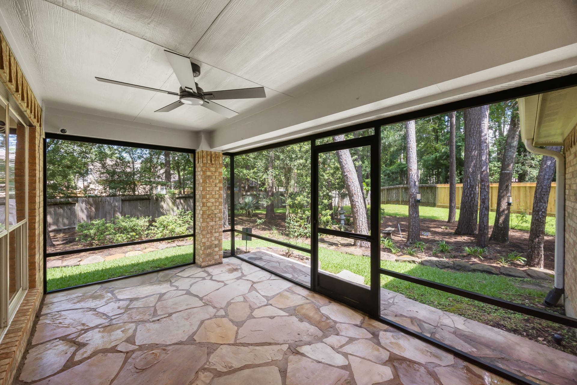 2 Gilded Crest Court, The Woodlands, TX 77382 Enclosed patio right off the living room. Perfect to keep mosquitoes away and enjoy the amazing backyard.