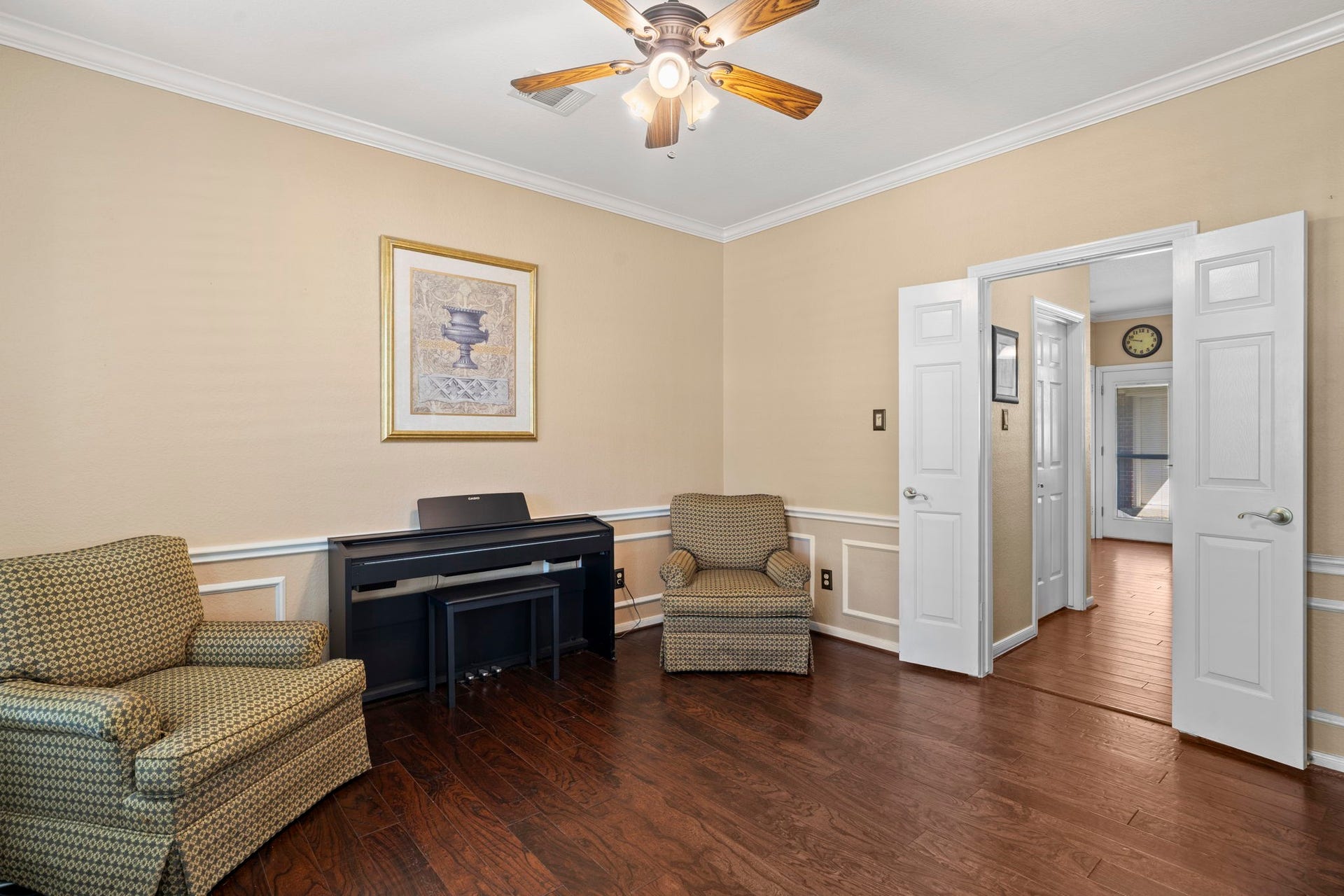 3407 Autumn Bend Drive, Sugar Land, TX 77479 The formal dining room, currently utilized as a music room, is conveniently located adjacent to the kitchen, offering a versatile space ideal for entertaining or creative use.
