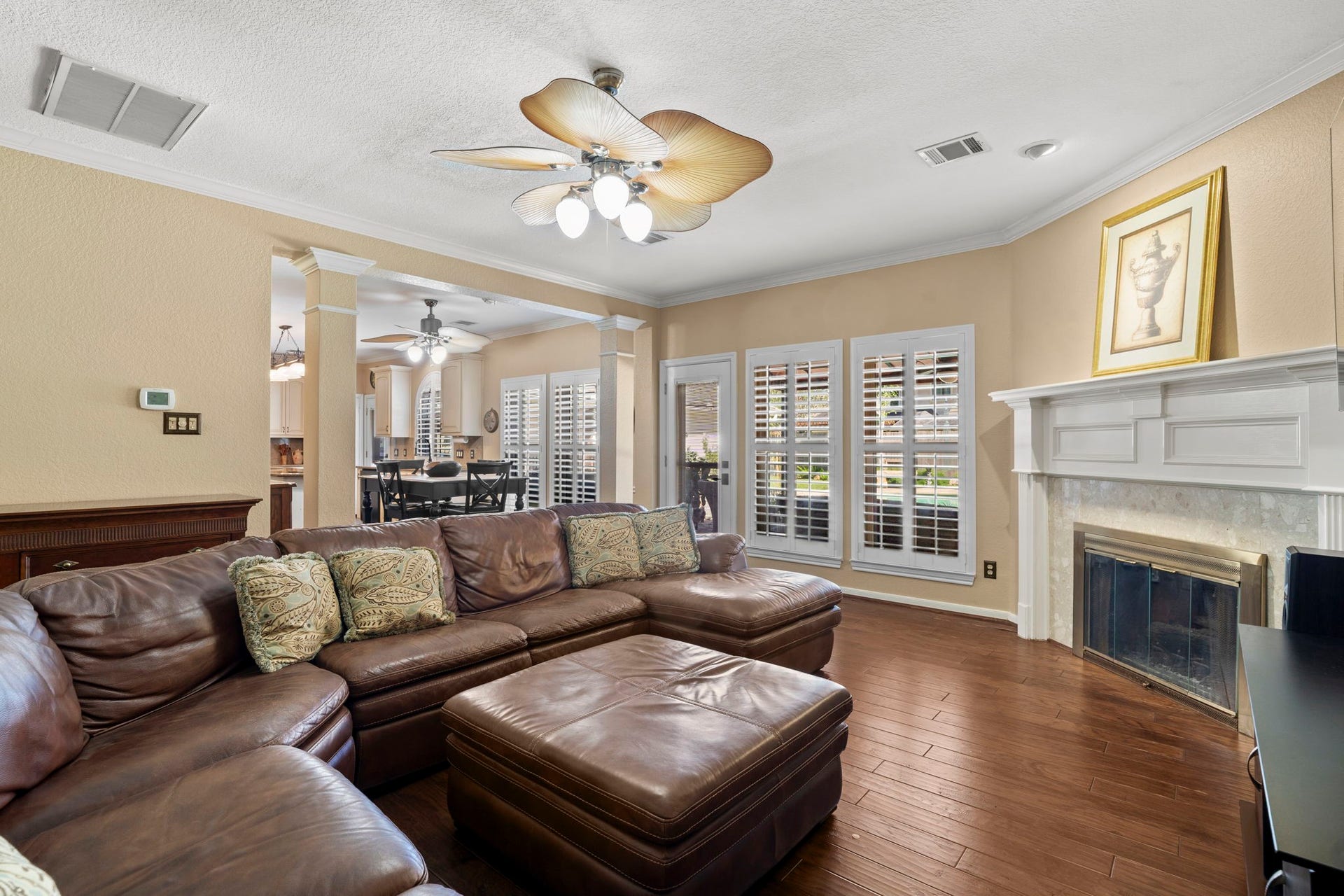 3407 Autumn Bend Drive, Sugar Land, TX 77479 Relax by the fireplace in the inviting family room, ideally situated near the kitchen and breakfast area, with direct access to the patio and pool.