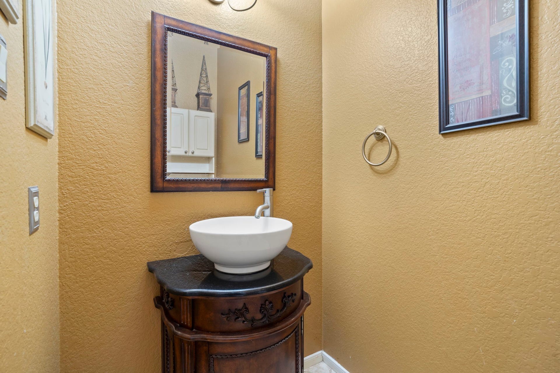 3407 Autumn Bend Drive, Sugar Land, TX 77479 A conveniently located first-floor half bath sits at the center of the home, providing easy access and comfort for guests.