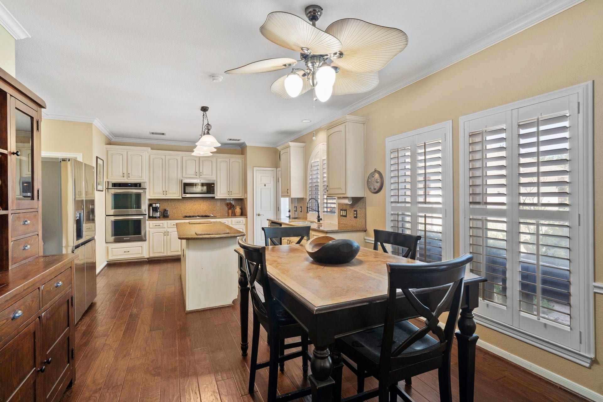 3407 Autumn Bend Drive, Sugar Land, TX 77479 Youll love the kitchen and breakfast area, bright and inviting, with windows that overlook the patio and pool, creating a cheerful space for daily meals and gatherings.