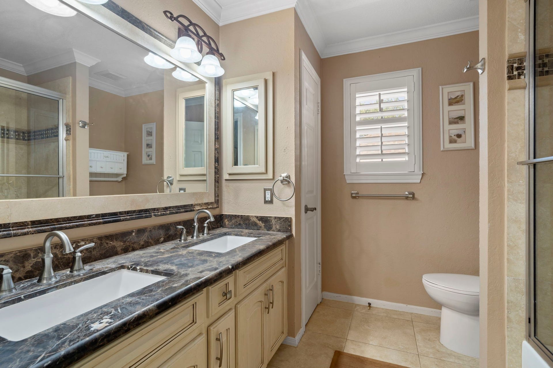 3407 Autumn Bend Drive, Sugar Land, TX 77479 This spacious bathroom is designed for convenience, featuring a dual vanity that allows two to get ready at once, along with a shower/tub combo and a linen closet for added storage.