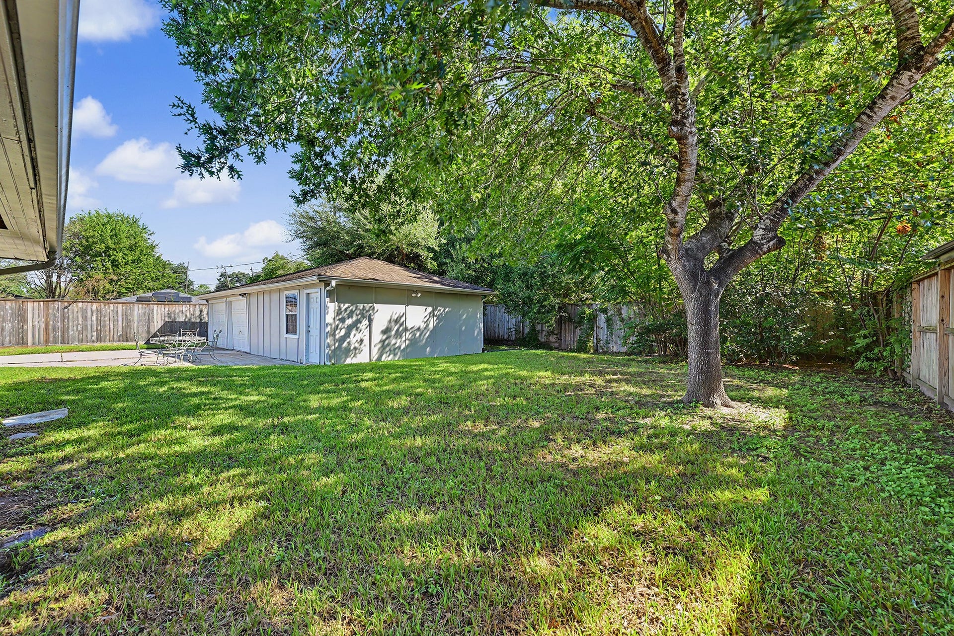 Lots of backyard space on this large lot, as well as paved area for skating, basketball or relaxing outdoors.  There is certainly room for a pool.