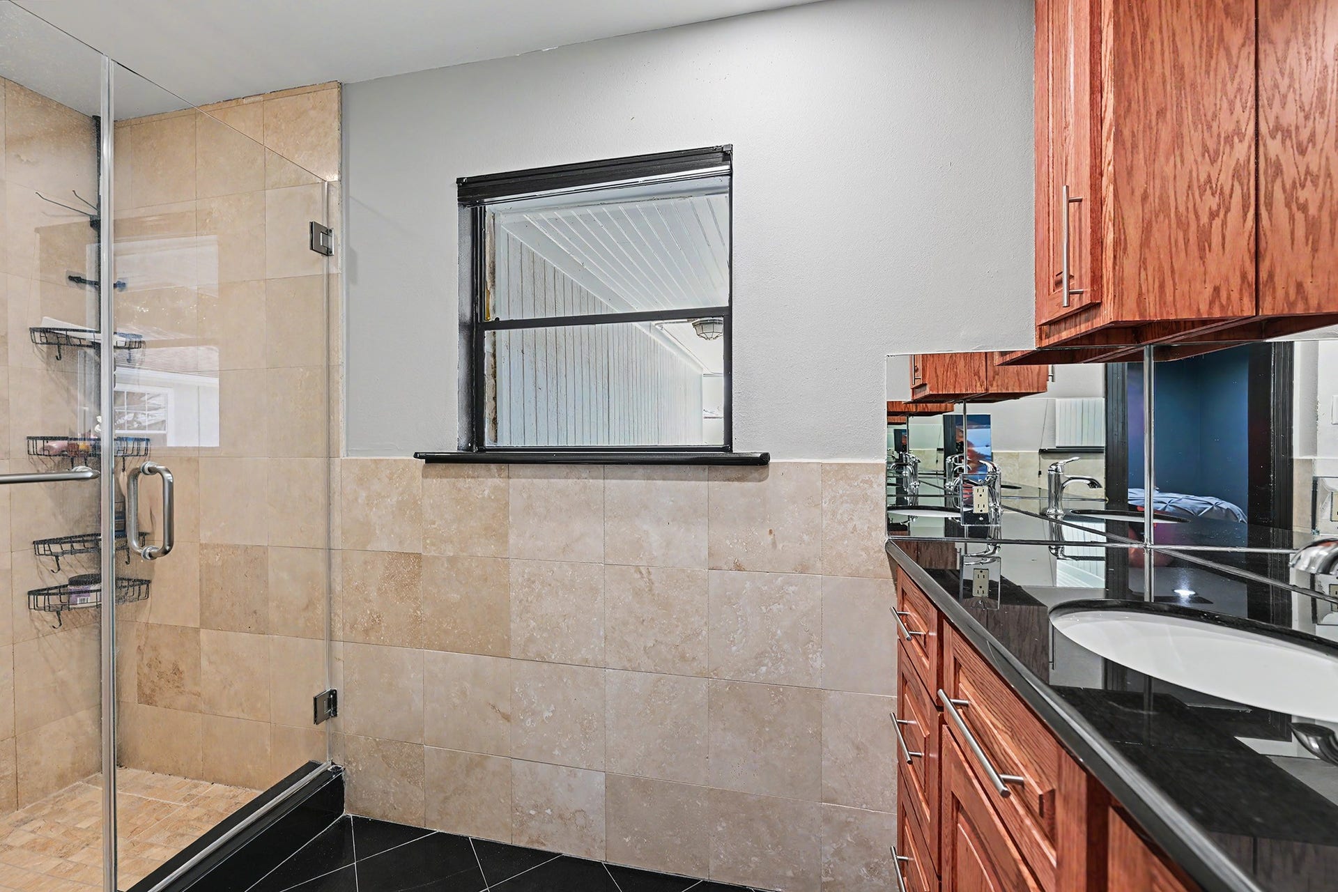 The primary bath has a large walk-in shower.