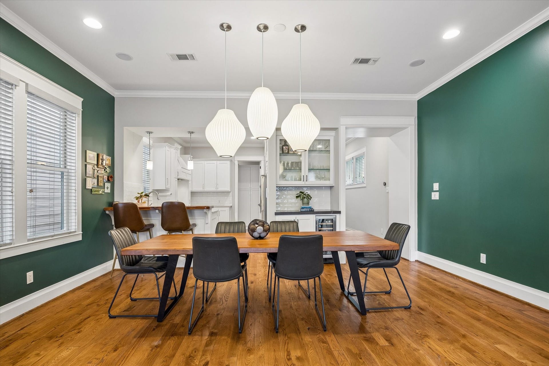 438 W 28th Street, Houston, TX 77008 Dinner parties just got a little more fun! This inviting dining area opens to the kitchen and features a convenient dry bar with glass front cabinets, storage below and a built-in wine chiller to keep your favorite bottles close at hand.