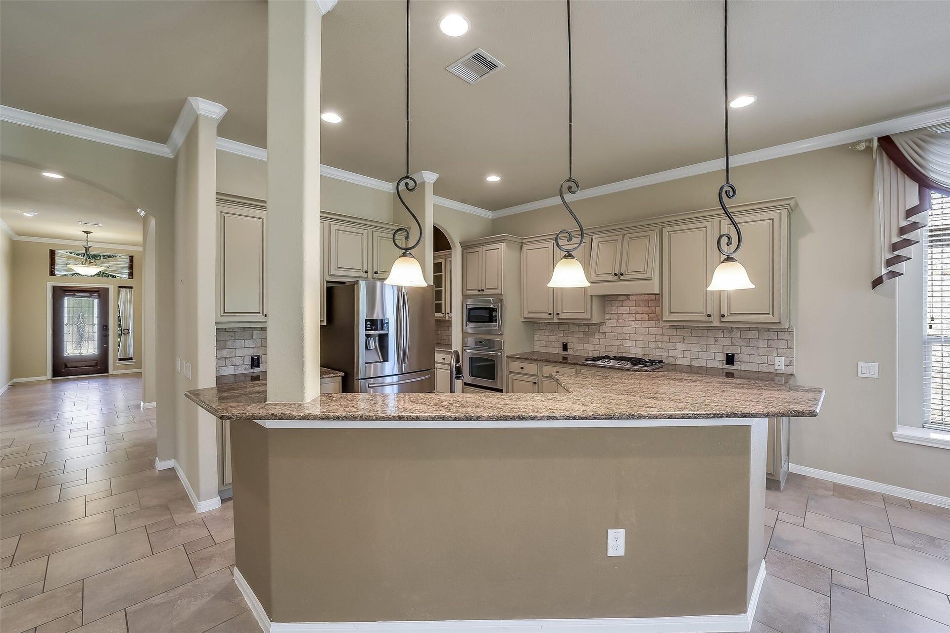16706 Curio Gray Trail, Cypress, TX 77433 Elegant pendant lights added above the bar.