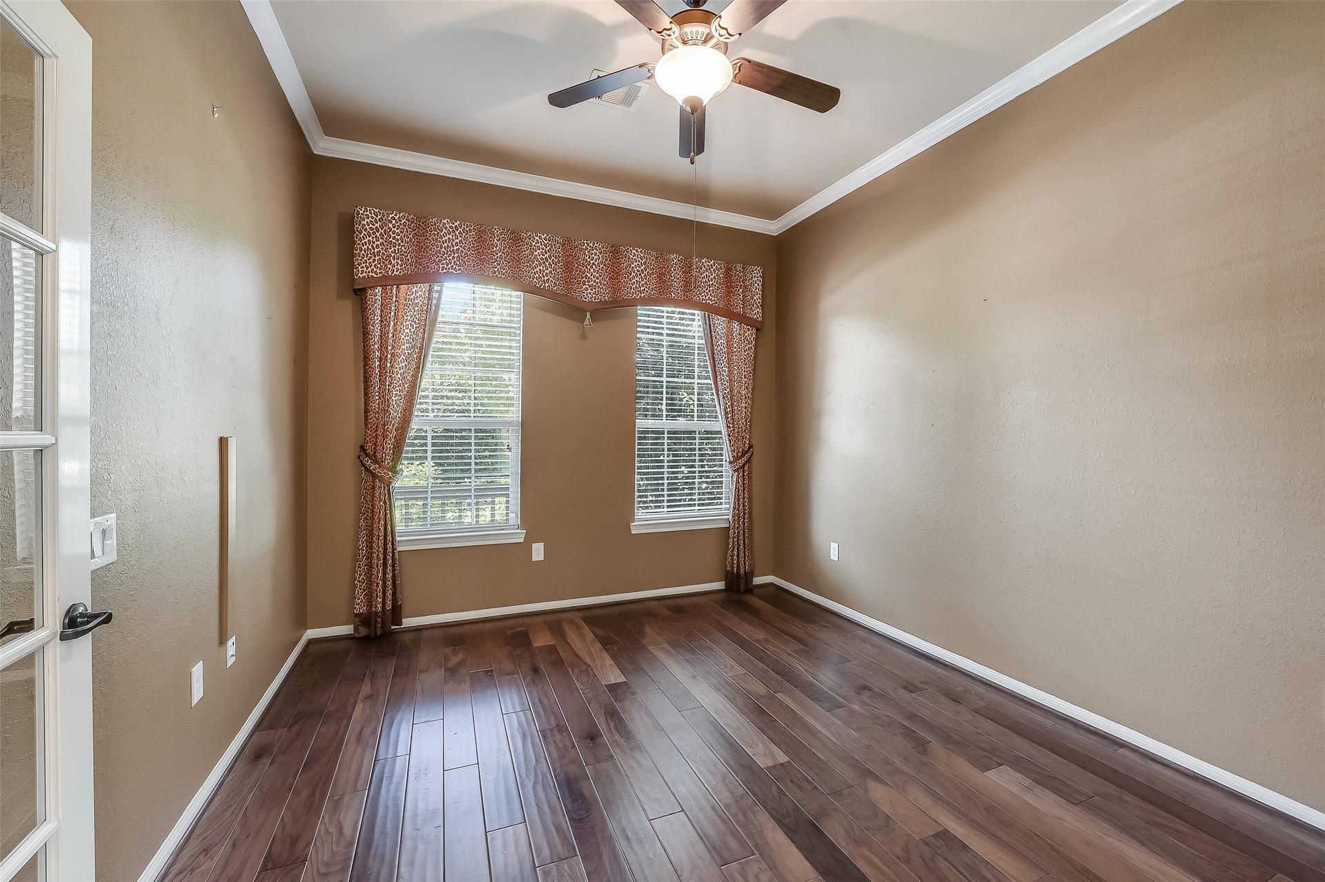 16706 Curio Gray Trail, Cypress, TX 77433 Study boasts rich hardwood flooring, custom window dressing, and crown moulding.