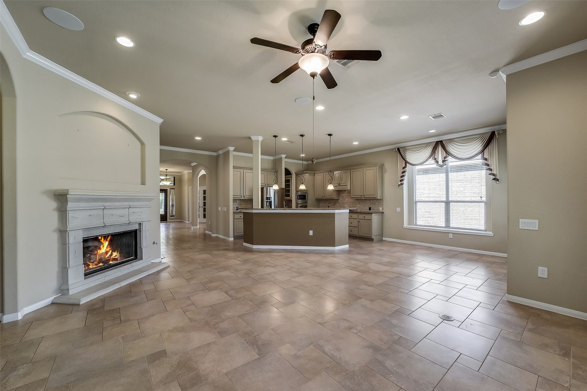 16706 Curio Gray Trail, Cypress, TX 77433 The cast stone fireplace surround and mantle is a beautiful traditional design. Inset niche is perfect for an art display with a focused accent light above.