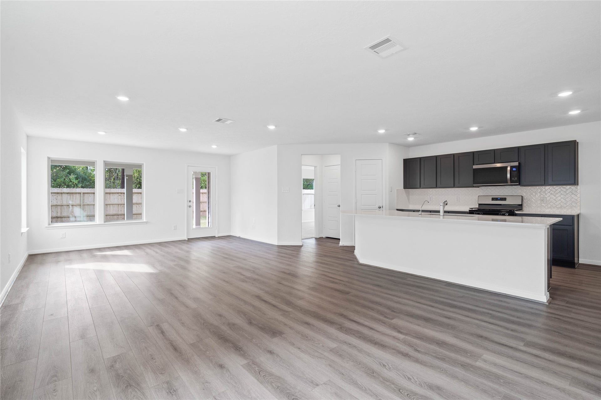 1710 Livadero Lane, Fresno, TX 77545 Stunning open-concept design seamlessly connecting the living, dining, and kitchen areasperfect for both everyday living and entertaining!