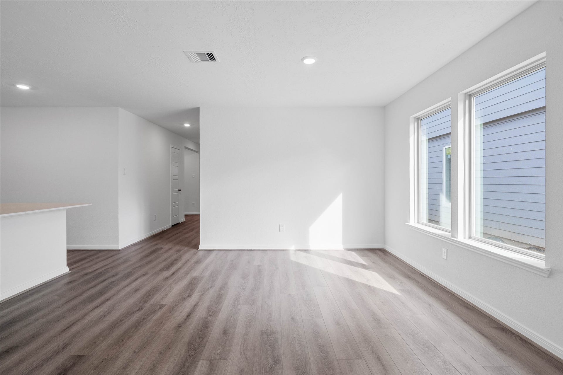 1710 Livadero Lane, Fresno, TX 77545 Start your day with a warm cup of coffee and quality time in this charming dining area! Highlights include large windows, custom neutral paint, vinyl plank flooring, and high ceilings with recessed lighting.