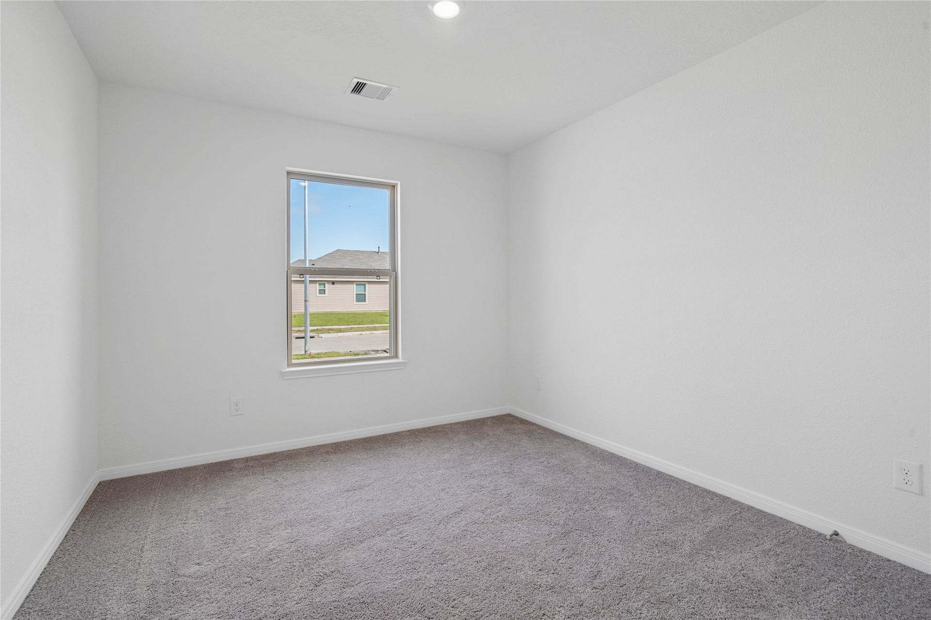 1710 Livadero Lane, Fresno, TX 77545 Tucked peacefully in the front of the home is this secondary bedroom. It features plush carpet flooring, large window, and closet space.