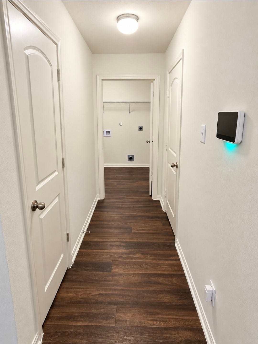 12221 Seacrest Lane, Texas City, TX 77568 Hallway leading to the utility room with pantry on the left and garage door to your right.