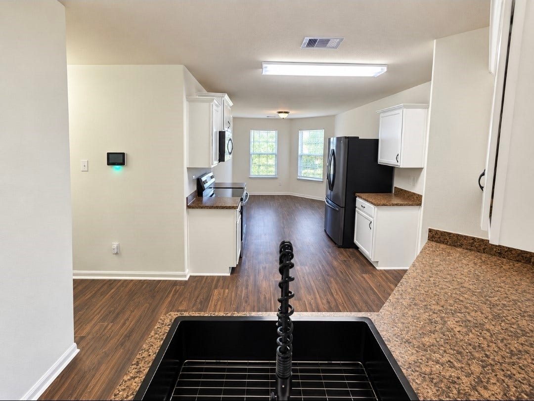 12221 Seacrest Lane, Texas City, TX 77568 Kitchen with a brand-new oven and oversized size. Black stainless steel fridge to convey.