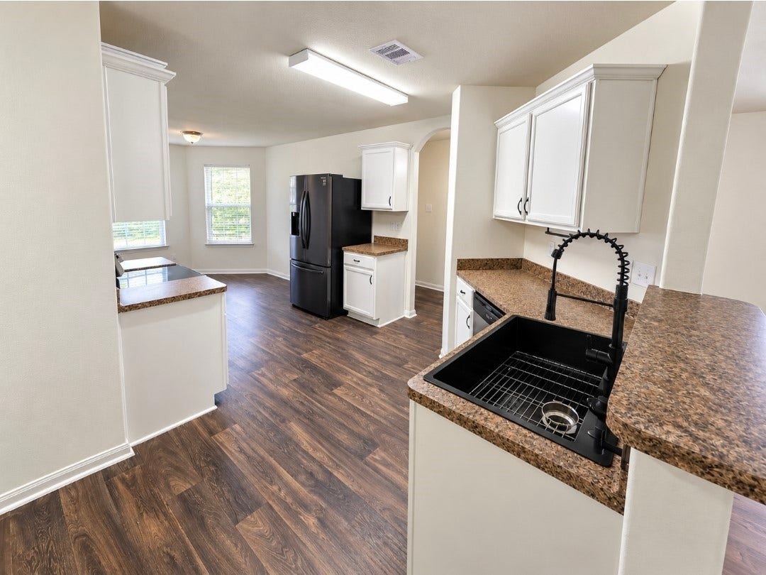 12221 Seacrest Lane, Texas City, TX 77568 Kitchen with a brand-new oven and oversized size. Black stainless steel fridge to convey.