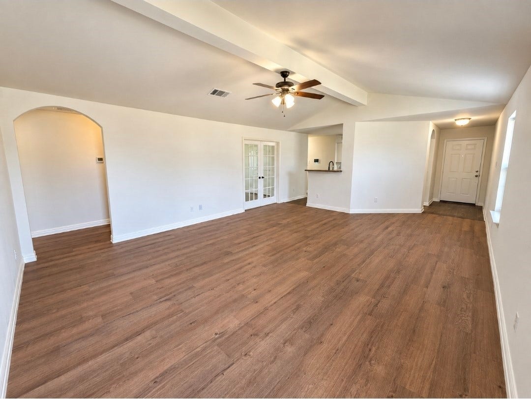 12221 Seacrest Lane, Texas City, TX 77568 The spacious living room has brand-new luxury vinyl flooring and high ceilings.